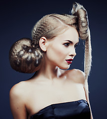 Image showing young elegant woman with creative hair style leopard print close