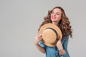 Image showing The girl in straw hat