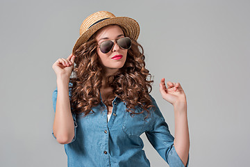 Image showing girl in sunglasses and straw