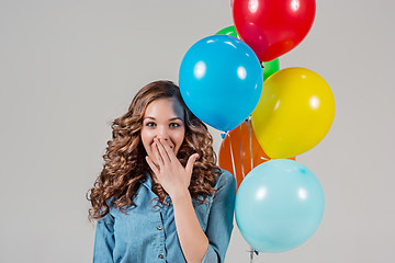 Image showing girl with bunch of colorful balloons