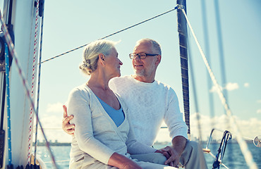 Image showing senior couple hugging on sail boat or yacht in sea