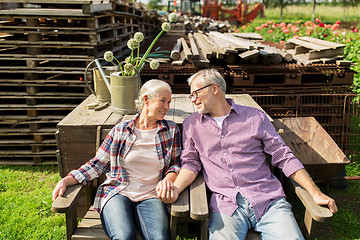 Image showing happy senior couple at summer farm