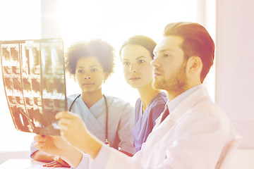 Image showing group of doctors looking to x-ray at hospital