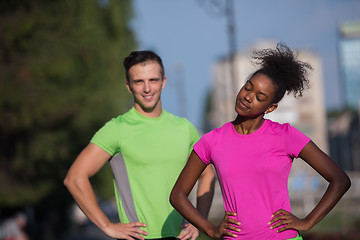 Image showing portrait of young multietnic jogging couple ready to run