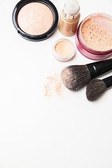 Image showing Powder, foundation and brushes on the white background