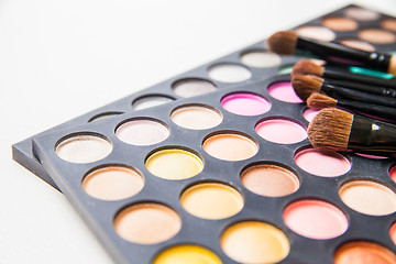 Image showing Makeup brushes and make-up eye shadows