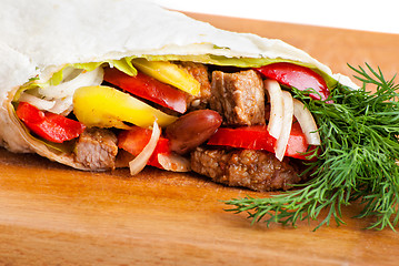 Image showing beef burrito with peppers, onion and tomato