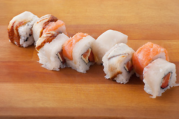 Image showing Closeup japanese sushi on wooden plate