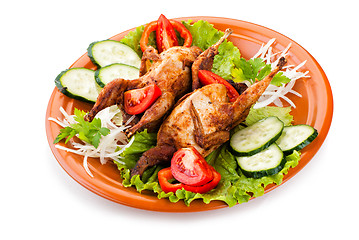 Image showing Two whole quail with cucumber, tomatoes and onion