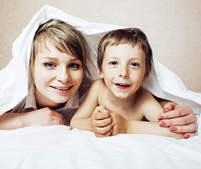 Image showing young blond woman with little boy in bed, mother and son, happy familyyoung blond woman with little boy in bed, mother and son, happy family