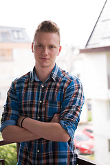 Image showing man standing at balcony