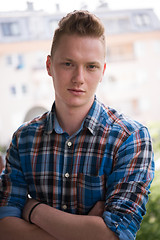 Image showing man standing at balcony