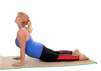 Image showing Yoga trainer showing stretching.