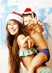 Image showing funny family in red hats celebrating new year, mother with son happy smiling, lifestyle people concept