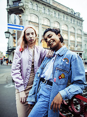 Image showing Two teenage girls infront of university building smiling, having