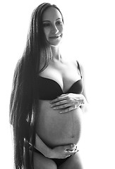 Image showing beauty sexy brunette pregnant woman isolated black and white por