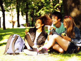 Image showing cute group of teenages at the building of university with books 