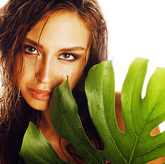 Image showing young brunette elegant woman with green leaf isolated on white c