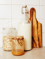 Image showing real comfort wooden kitchen with breakfast ingredients close up