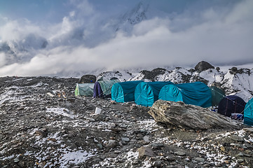 Image showing Blue tents on rocks