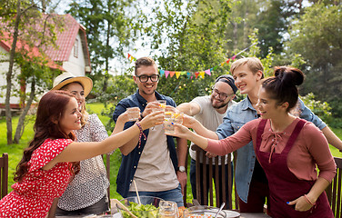 Image showing happy friends having party at summer garden