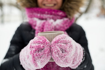 Image showing close up of woman with tea mug outdoors in winter