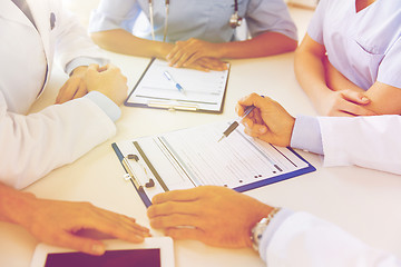 Image showing close up of doctors with clipboards at hospital