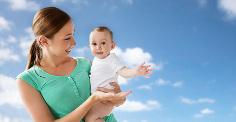 Image showing happy young mother with little baby