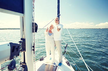 Image showing senior couple hugging on sail boat or yacht in sea