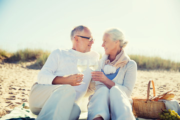 Image showing happy senior couple talking on summer beach