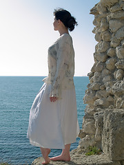 Image showing Lonely Young Woman Looks on Sea