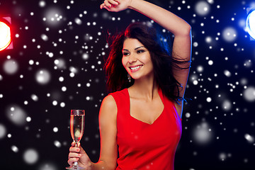 Image showing beautiful woman with champagne glass at nightclub