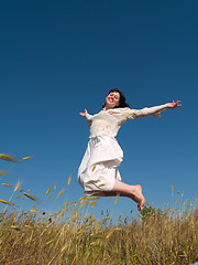 Image showing Happy Jumping Girl on Field