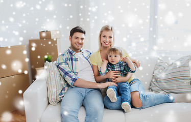 Image showing happy family with boxes moving to new home