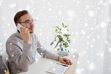 Image showing happy creative male worker calling on smartphone