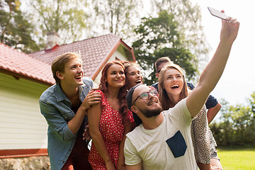 Image showing friends taking selfie at party in summer garden