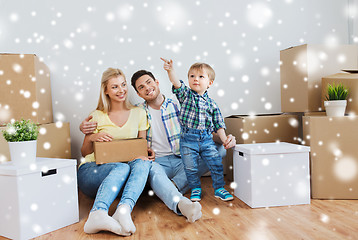 Image showing happy family with boxes moving to new home