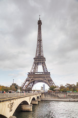 Image showing Eiffel tower surrounded by tourists