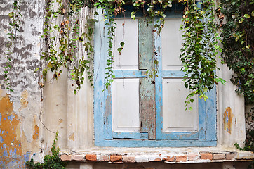 Image showing Wooden window on old dirty wall