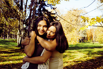 Image showing mature real mother with daughter outside autumn fall in park