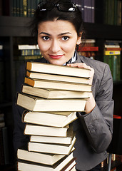 Image showing young teen girl in library among books emotional close up bookwarm