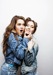 Image showing lifestyle and people concept: Fashion portrait of two stylish sexy girls best friends, over white background. Happy time for fun.