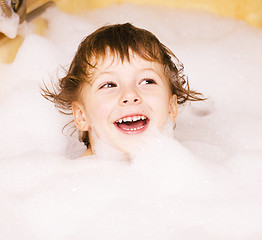 Image showing little cute boy in bathroom with bubbles close up