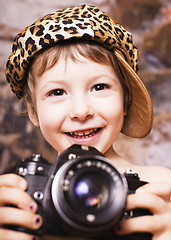 Image showing little cute boy in leopard cap and camera, young fashion photographer