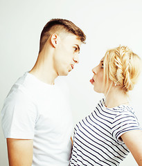 Image showing young pretty teenage couple, hipster guy with his girlfriend happy smiling and hugging isolated on white background, lifestyle people concept