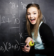 Image showing portrait of happy cute student with book in classroom