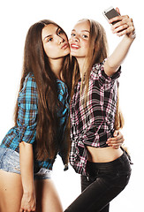 Image showing cute teenage girls making selfie isolated