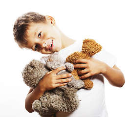 Image showing little cute boy with many teddy bears hugging isolated close up