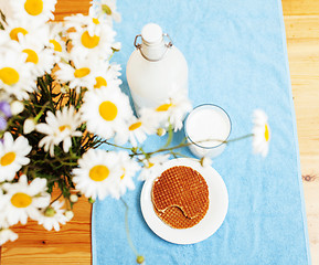 Image showing Simply stylish wooden kitchen with bottle of milk and glass on t