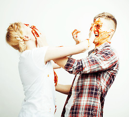 Image showing young pretty couple, lifestyle people concept: girlfriend and boyfriend cooking together, having fun, making mess isolated on white background